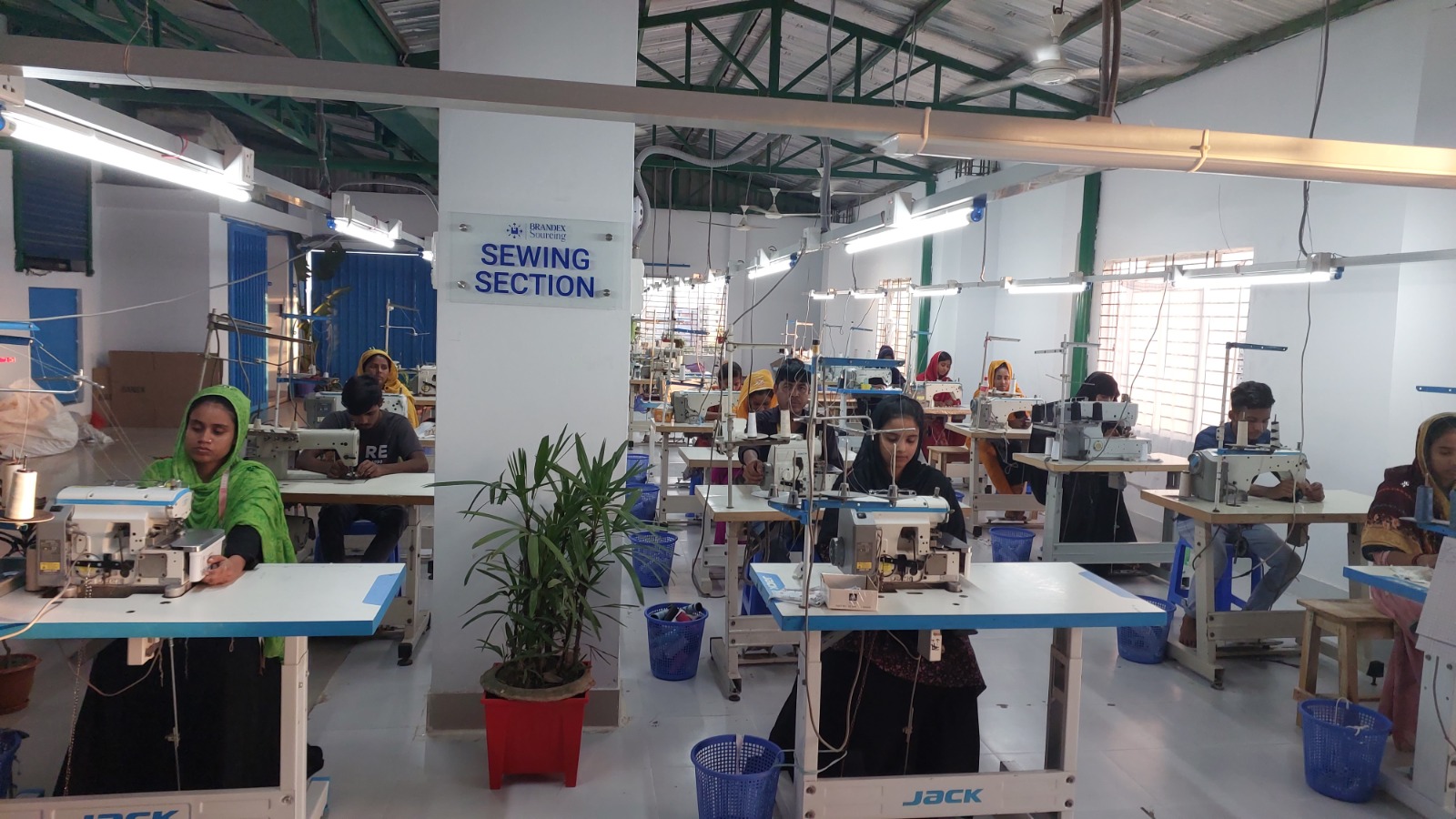 Brandex Sourcing sewing section factory floor with skilled workers operating JACK sewing machines