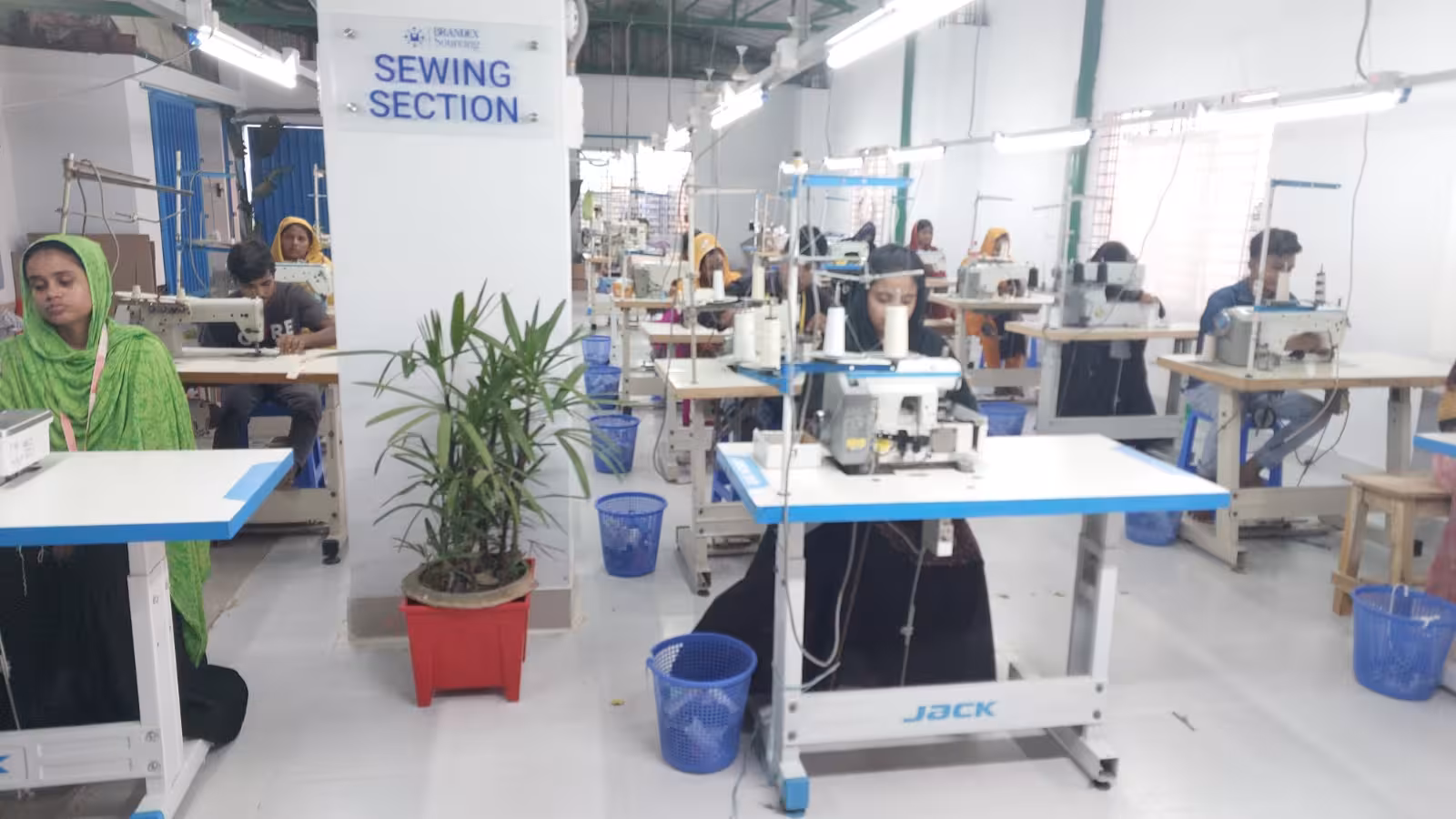Brandex Sourcing sewing section factory floor with skilled workers operating JACK sewing machines
