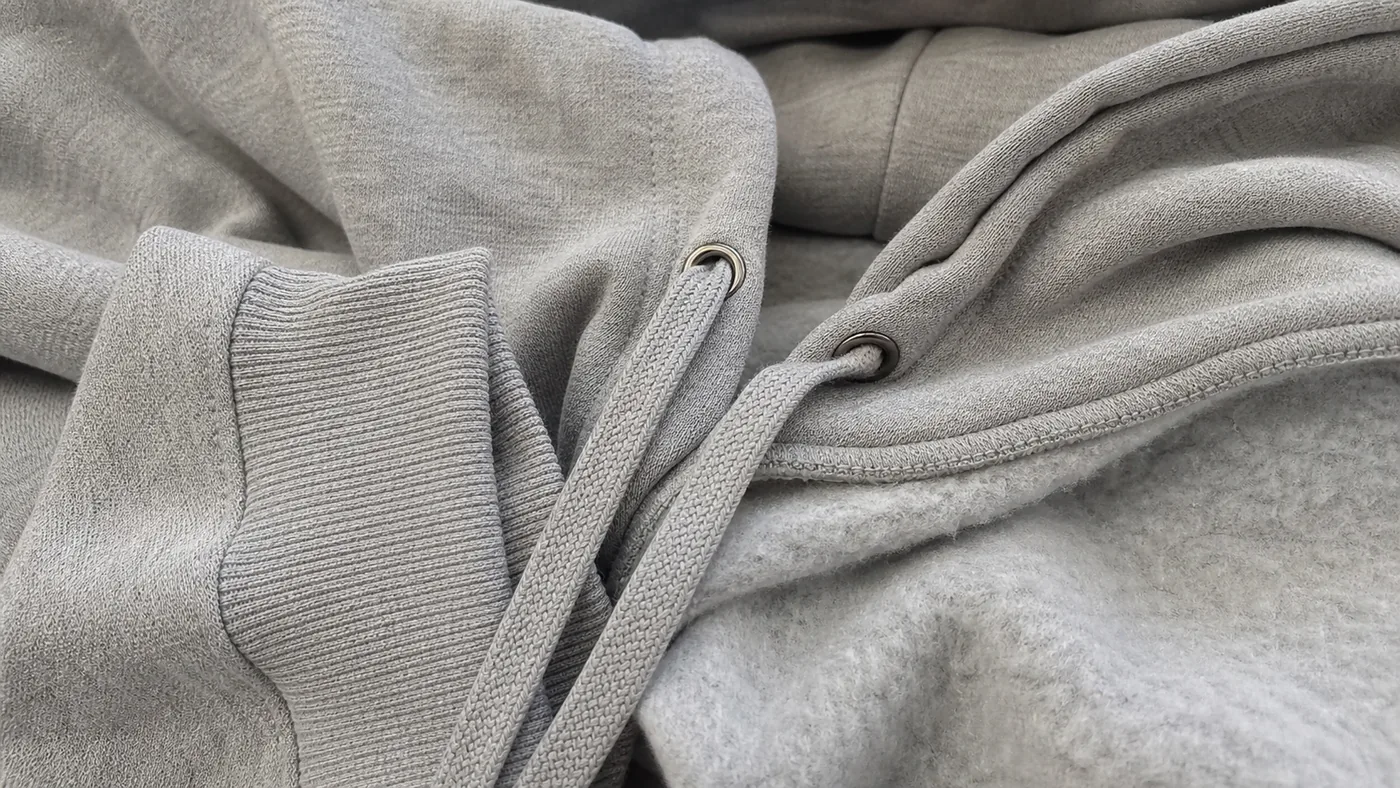 Heavy fleece hoodie drawstring and fabric close-up by Brandex Sourcing Bangladesh, custom hoodie detail manufacturer.
