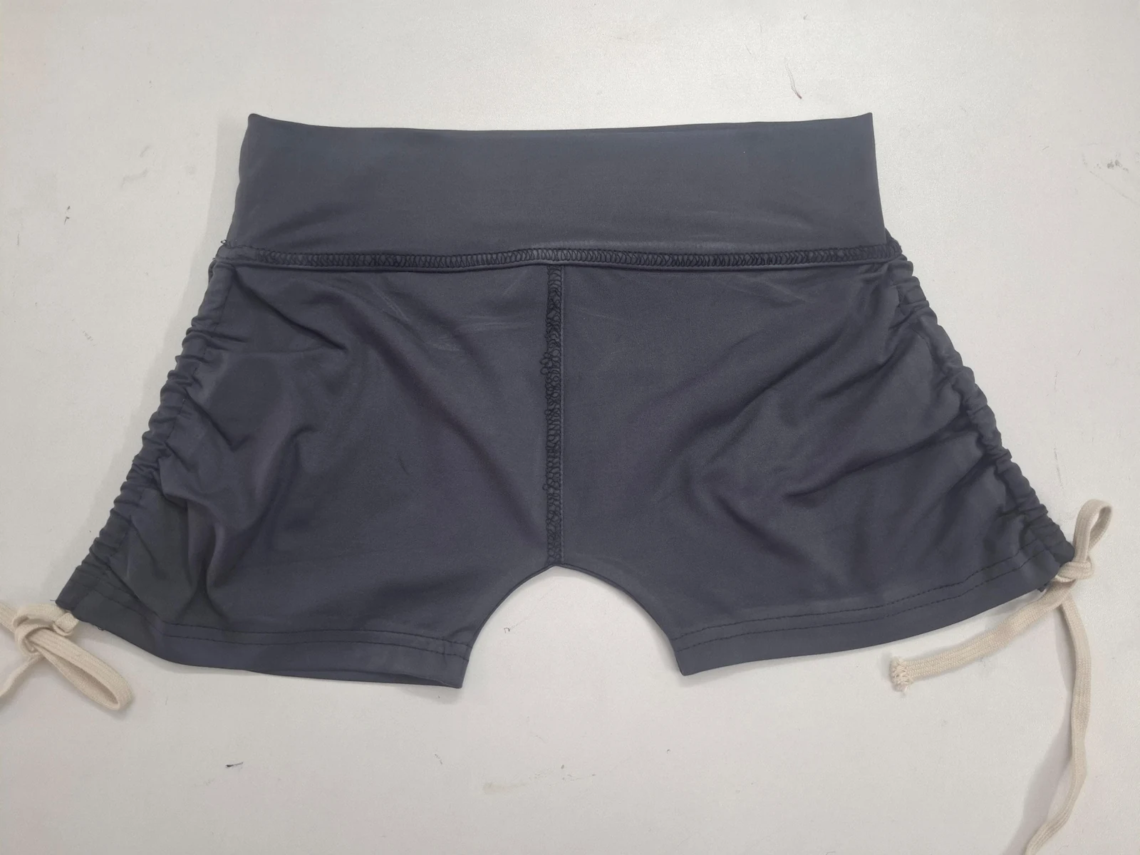 Black cycling shorts waistband and seam detail for nylon-spandex activewear production in Bangladesh by Brandex Sourcing.