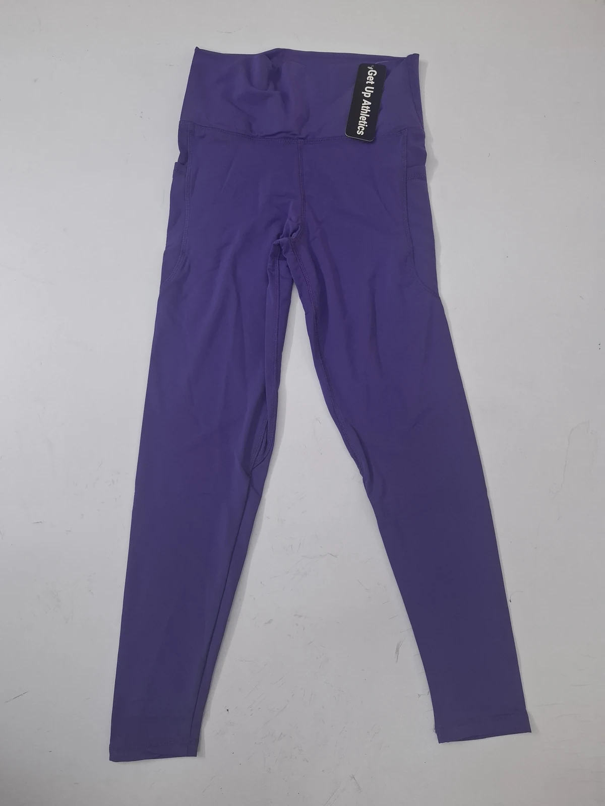 Custom purple leggings with side pocket for private-label activewear production in Bangladesh by Brandex Sourcing.